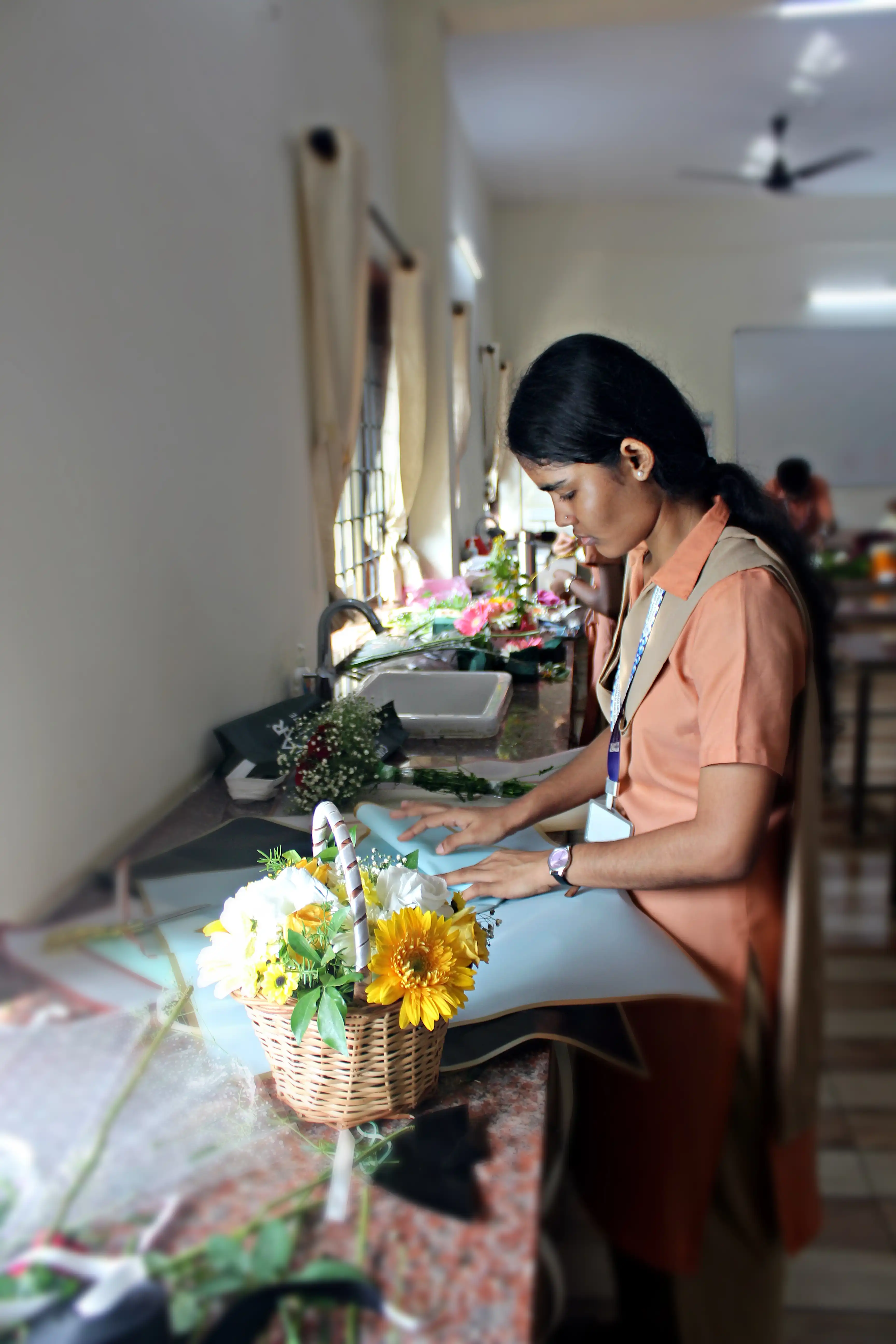 Students arranging flowers during the Flower Arrangement Competition