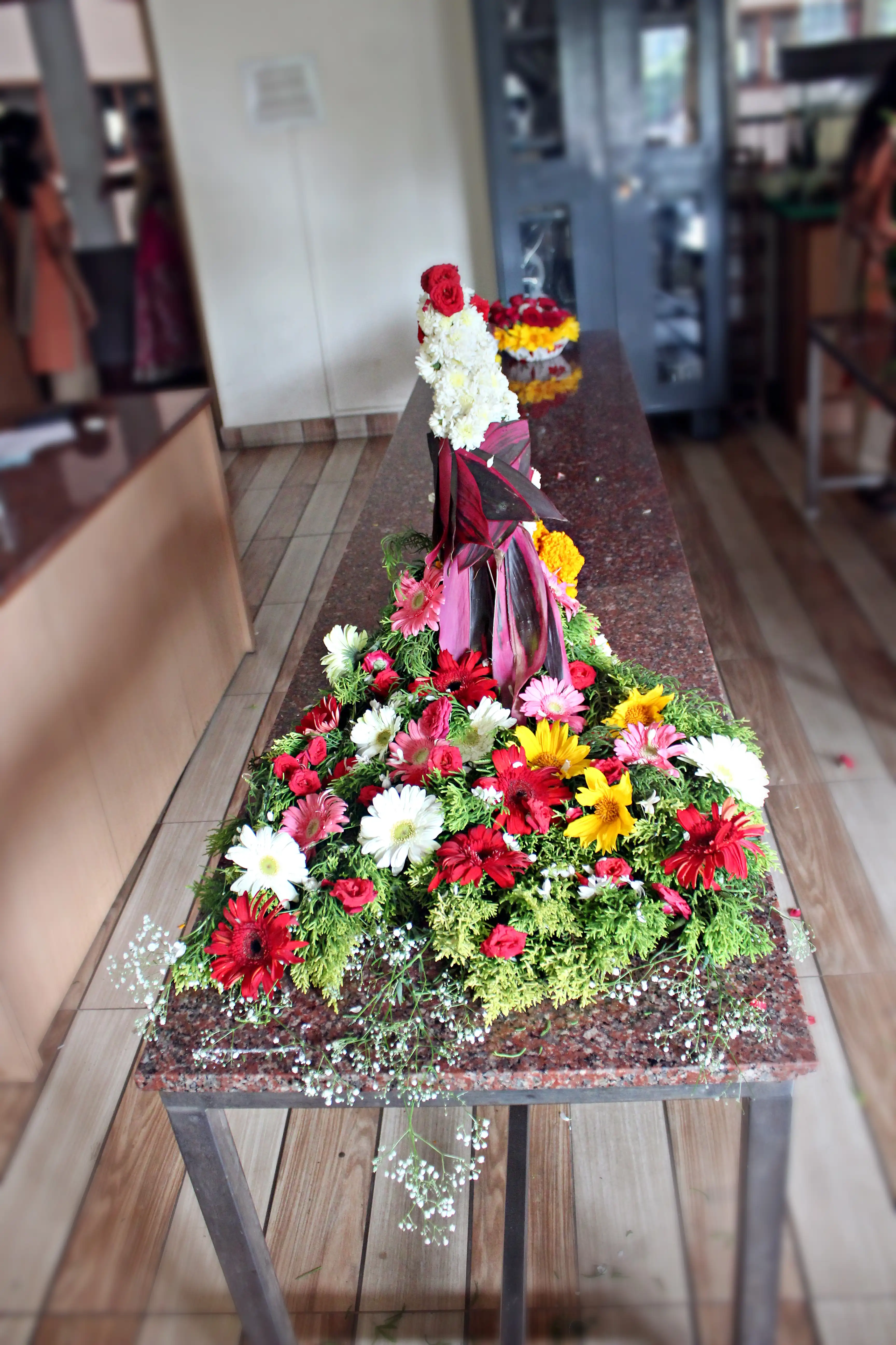 Colourful flowers arranged creatively by students
