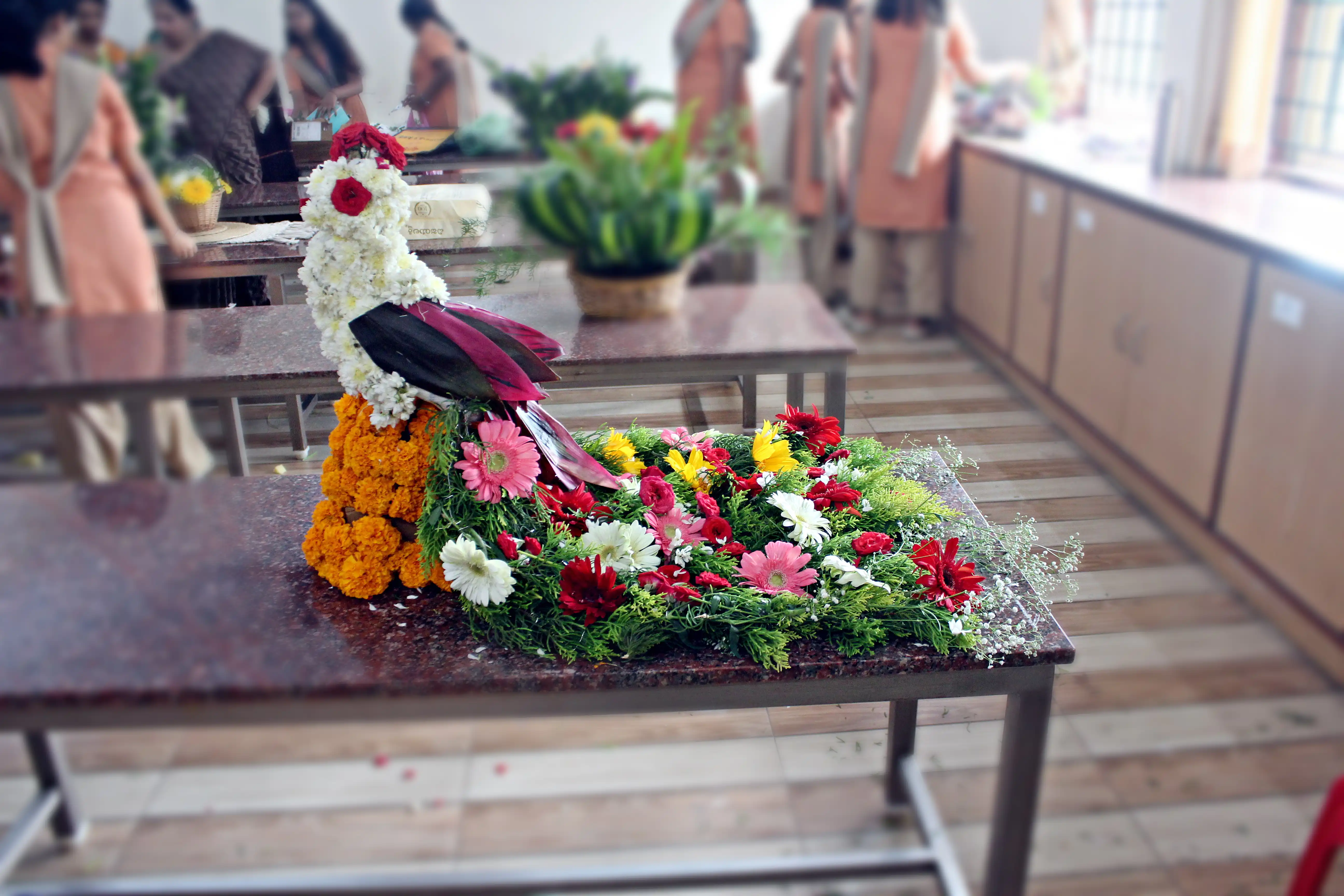 Colourful flowers arranged creatively by students