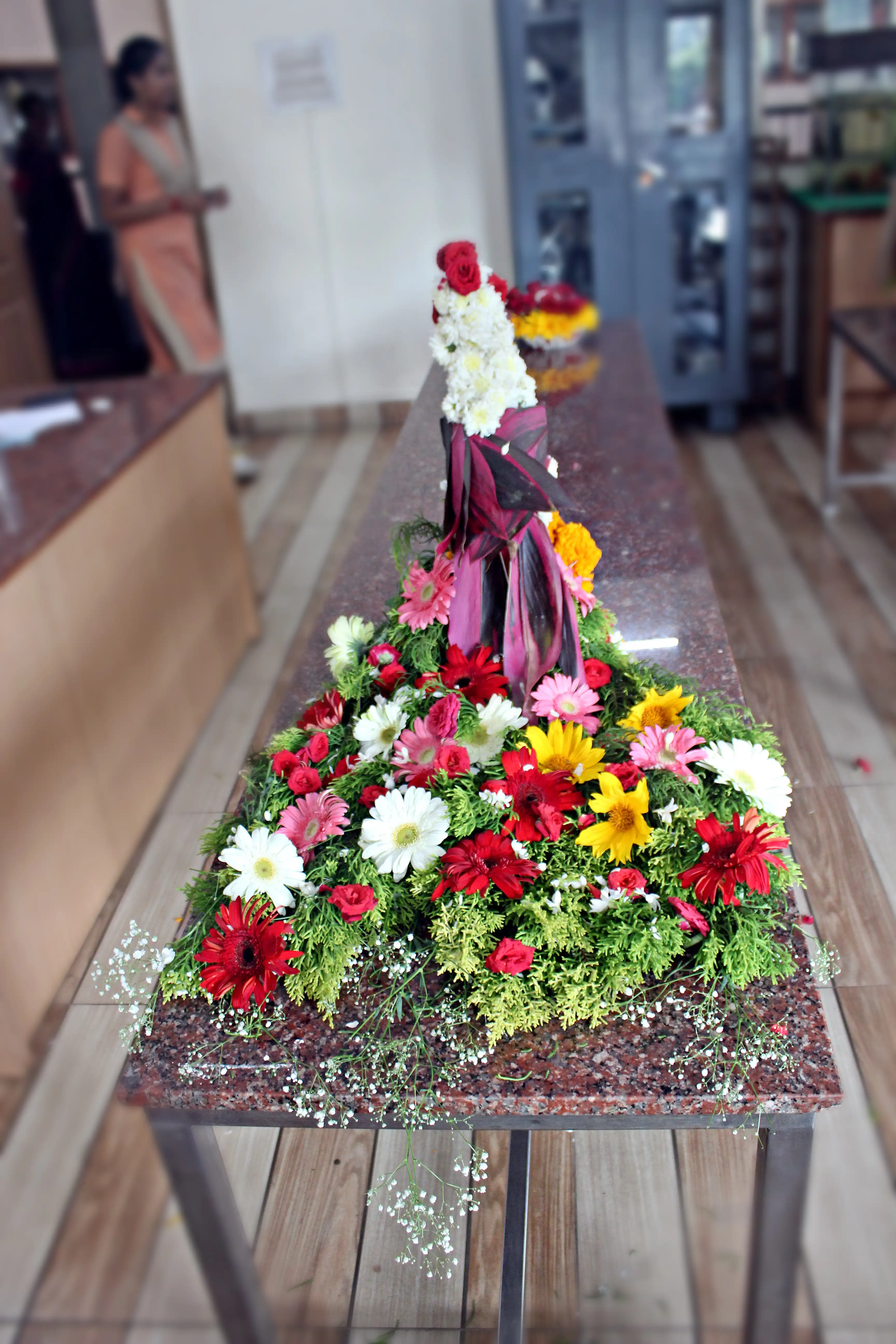 Colourful flowers arranged creatively by students