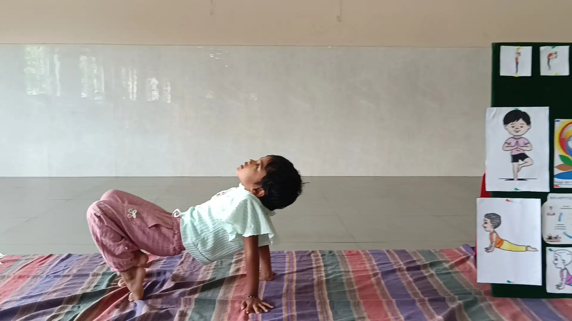 Children practicing yoga postures at Vidyodaya Public School