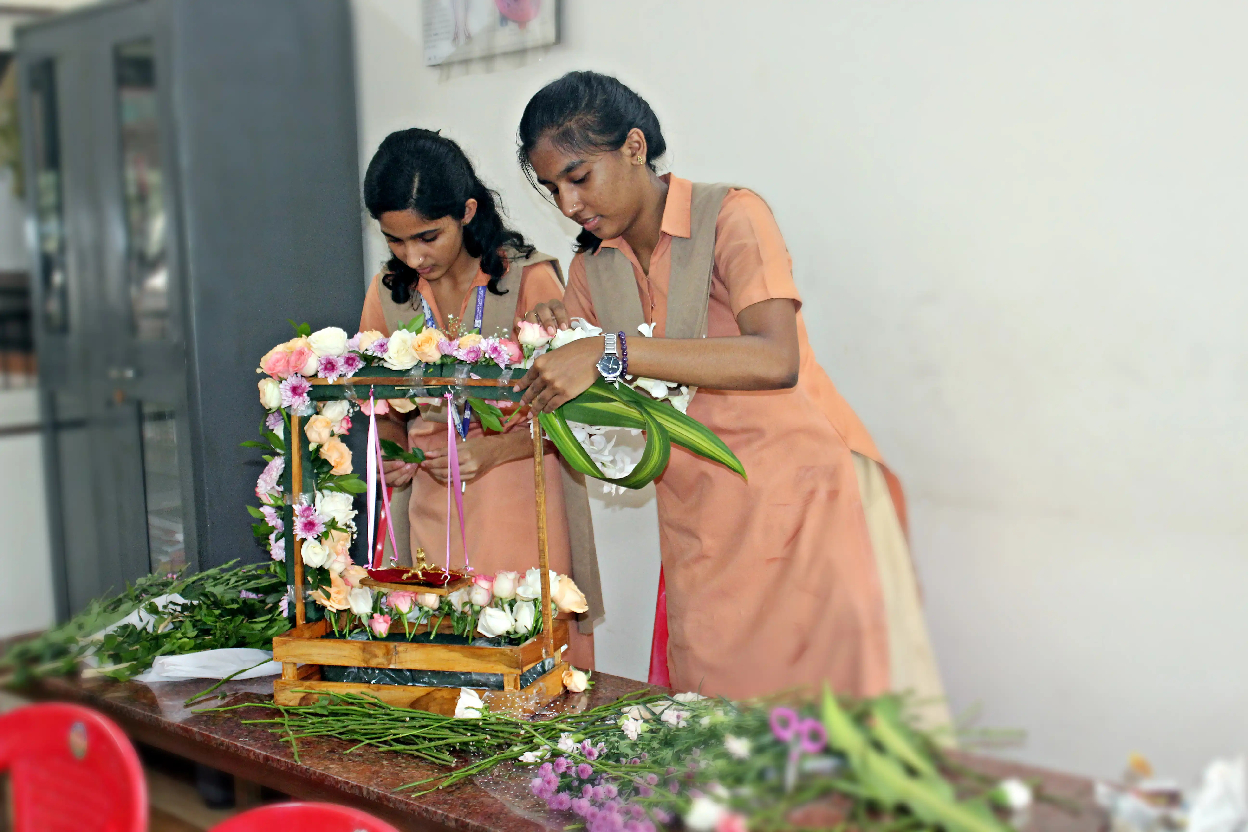 Students arranging flowers during the Flower Arrangement Competition