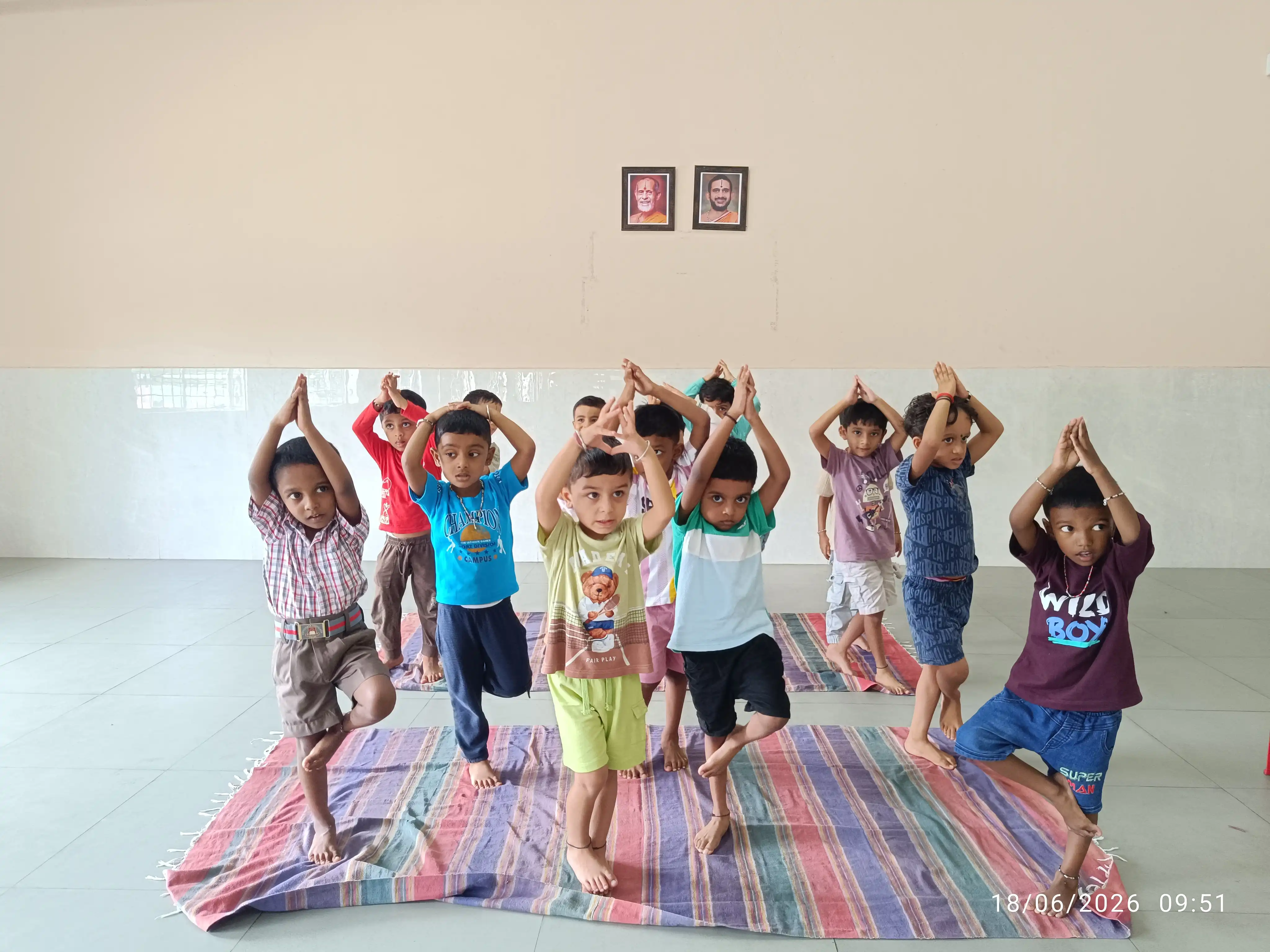 Children practicing yoga postures at Vidyodaya Public School