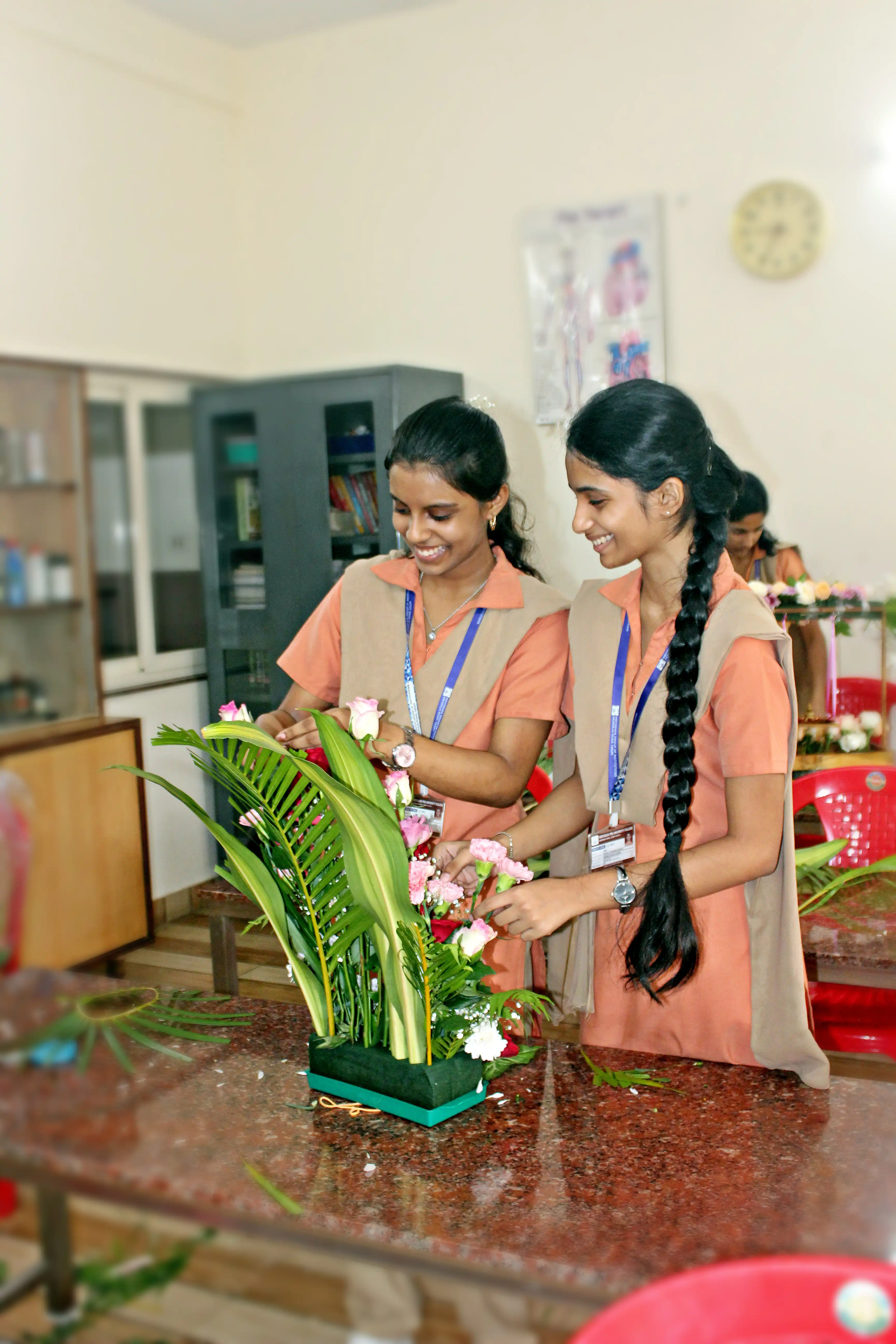 Students arranging flowers during the Flower Arrangement Competition