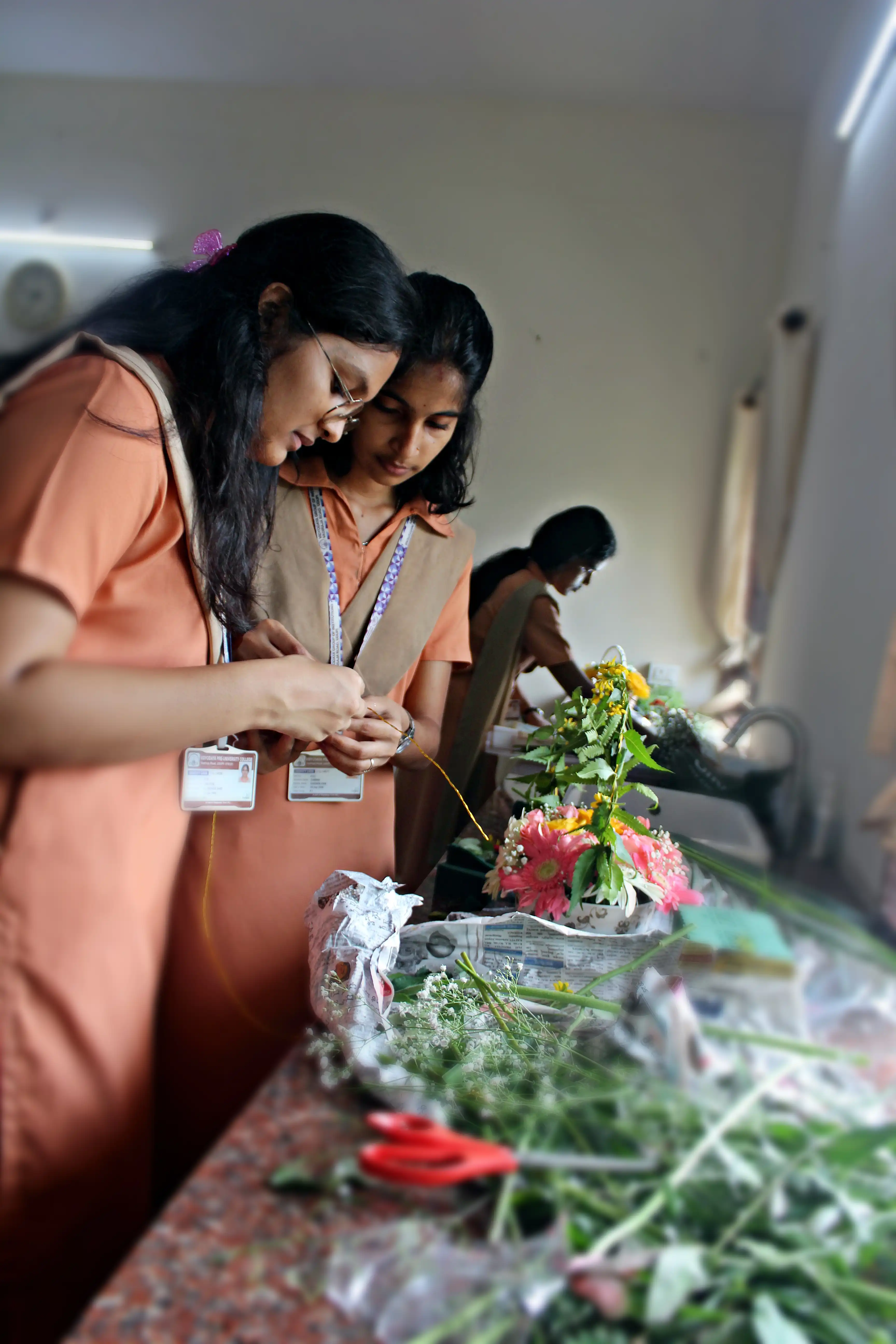 Students arranging flowers during the Flower Arrangement Competition