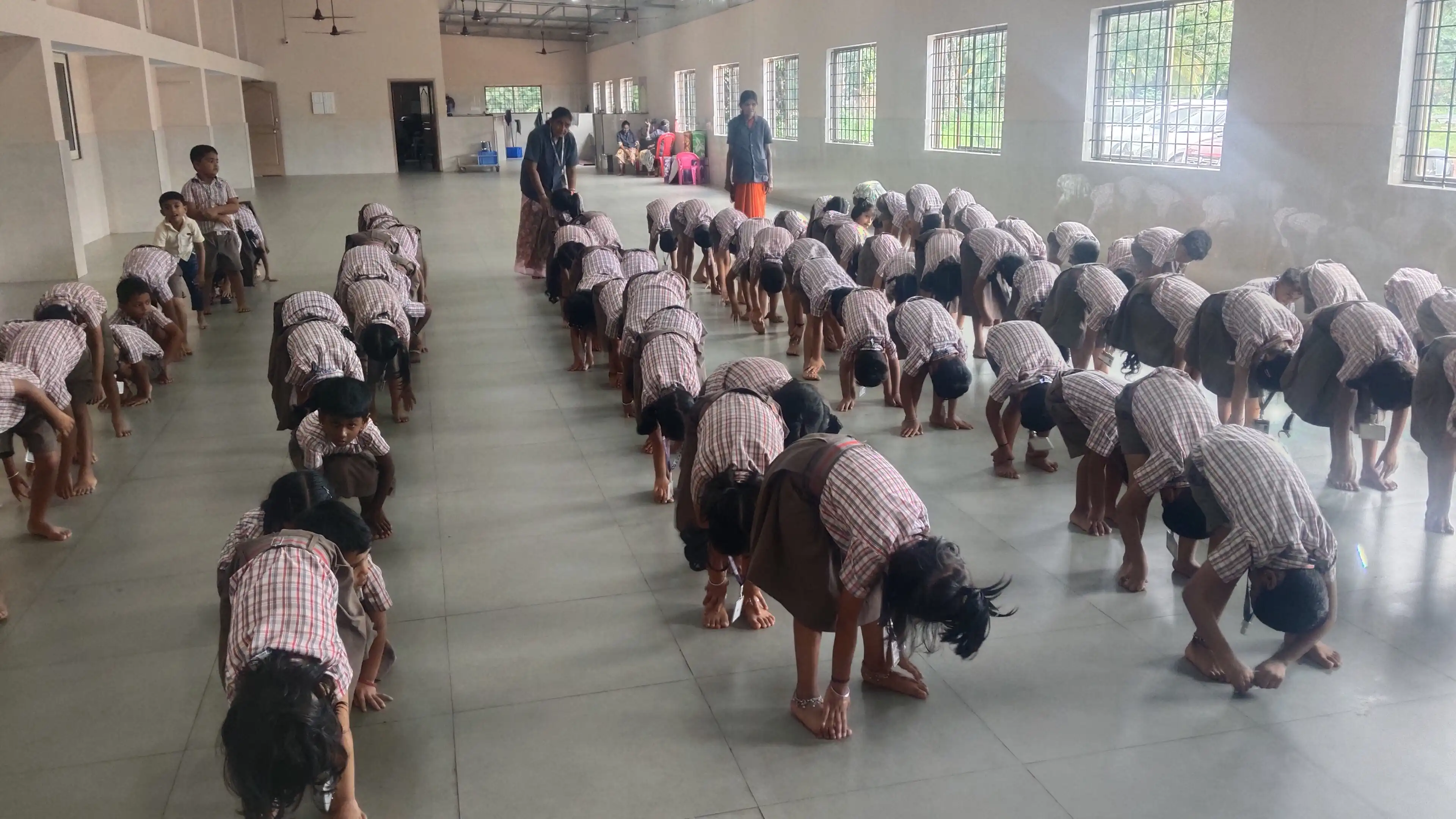 Children practicing yoga postures at Vidyodaya Public School