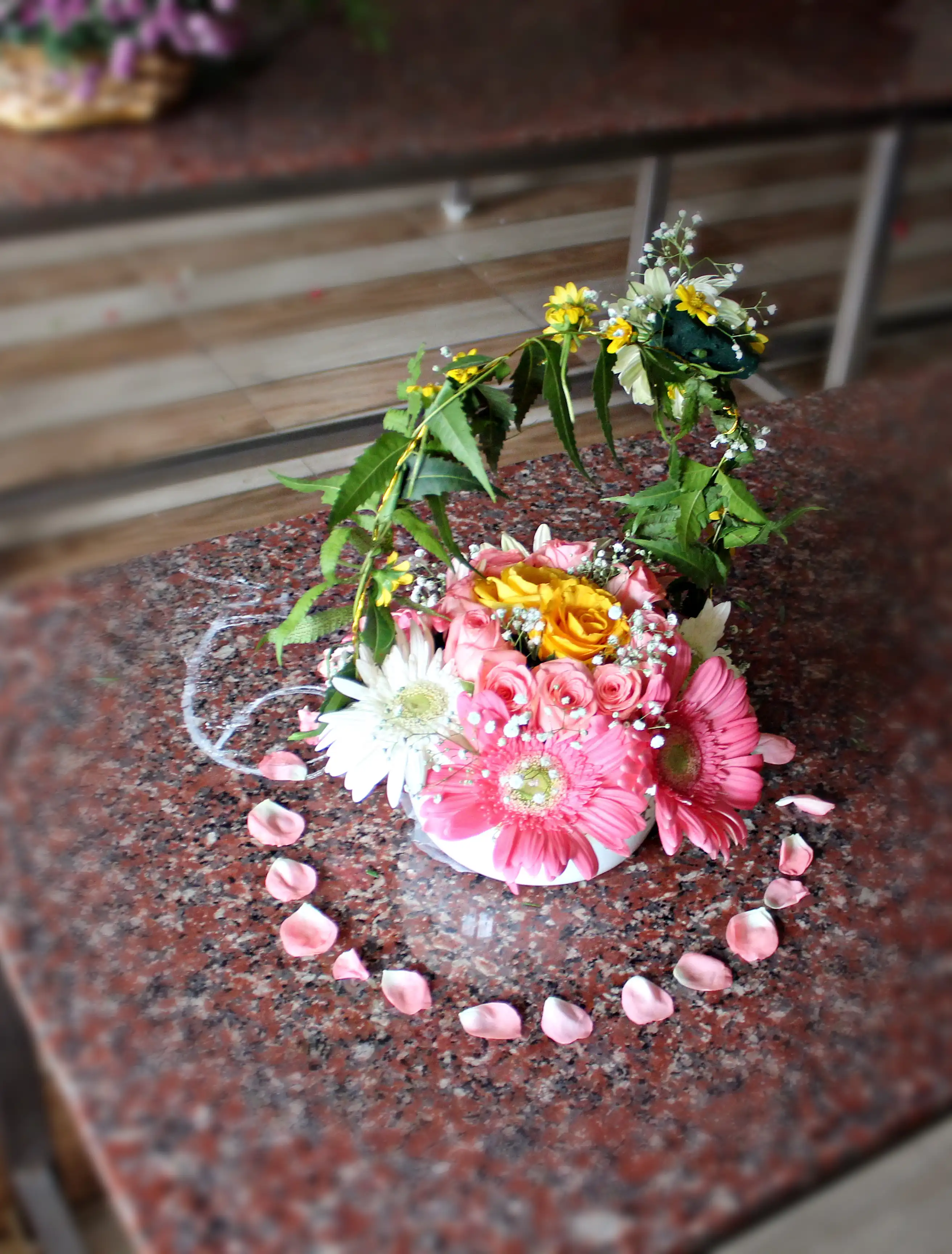 Colourful flowers arranged creatively by students