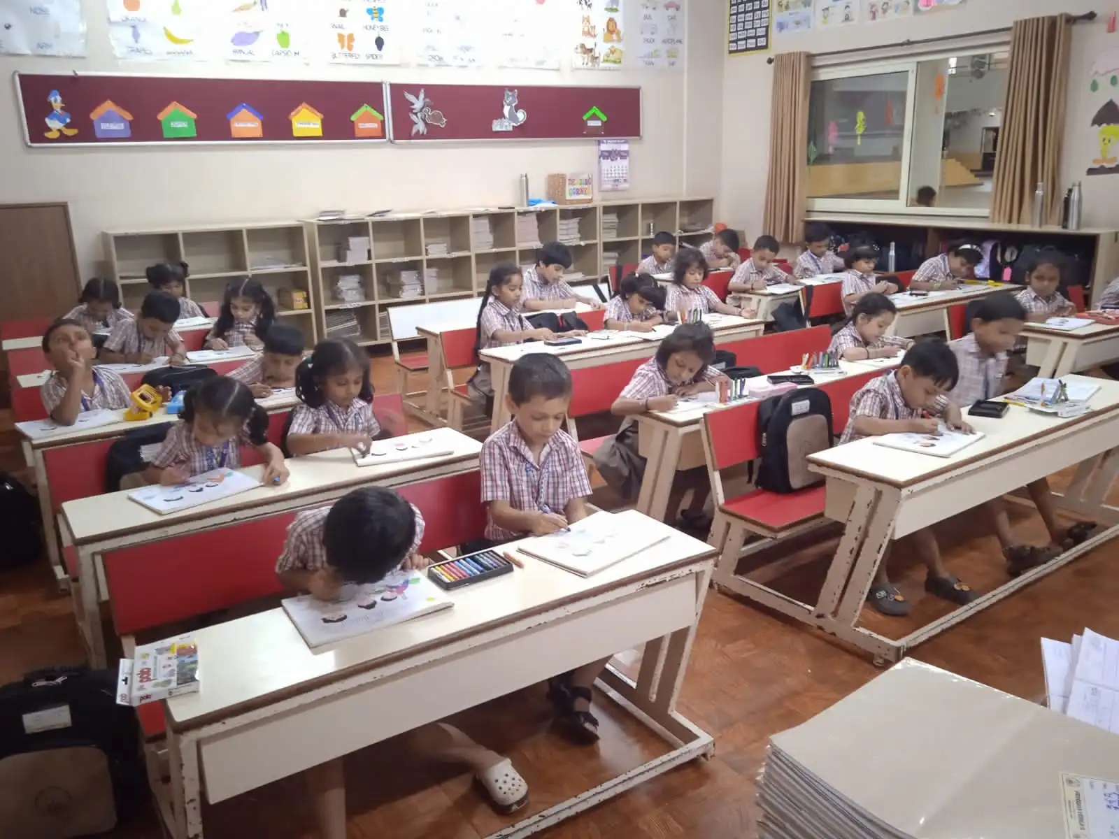 Children practicing yoga postures at Vidyodaya Public School