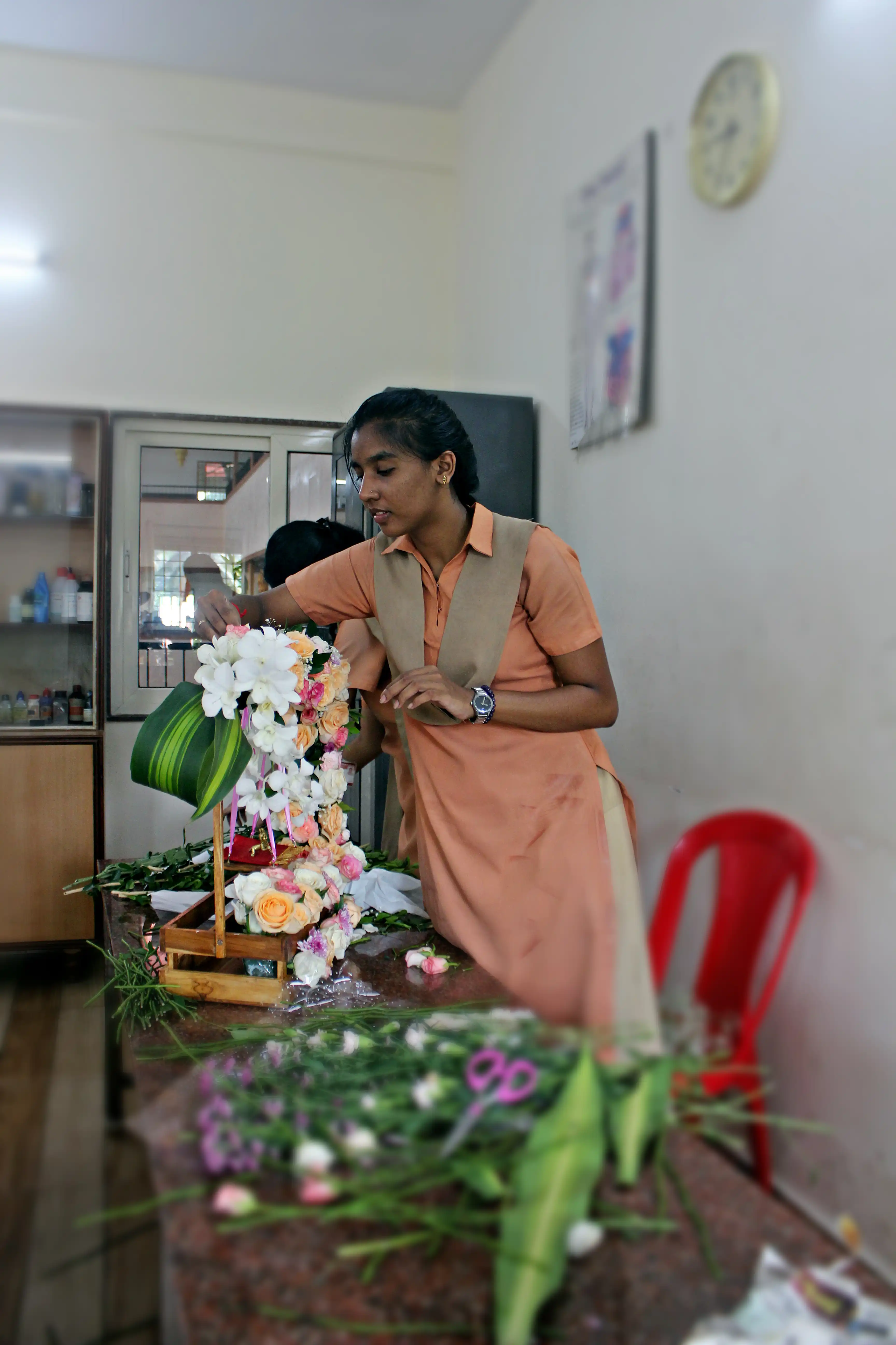 Students arranging flowers during the Flower Arrangement Competition