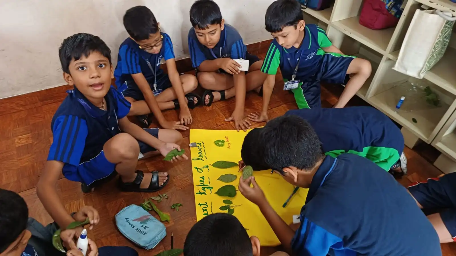 Vidyodaya Public School kids holding up posters and eco-friendly crafts during Vanamahotsav