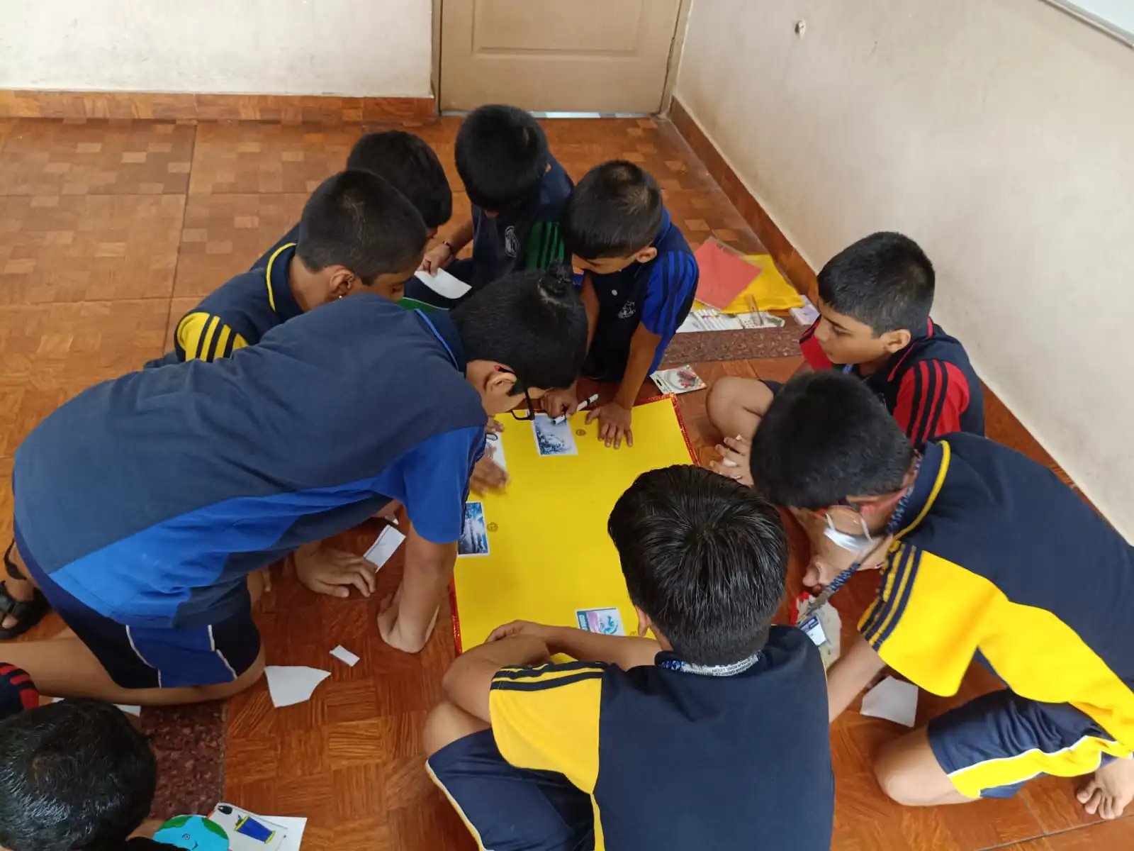 Vidyodaya Public School kids holding up posters and eco-friendly crafts during Vanamahotsav