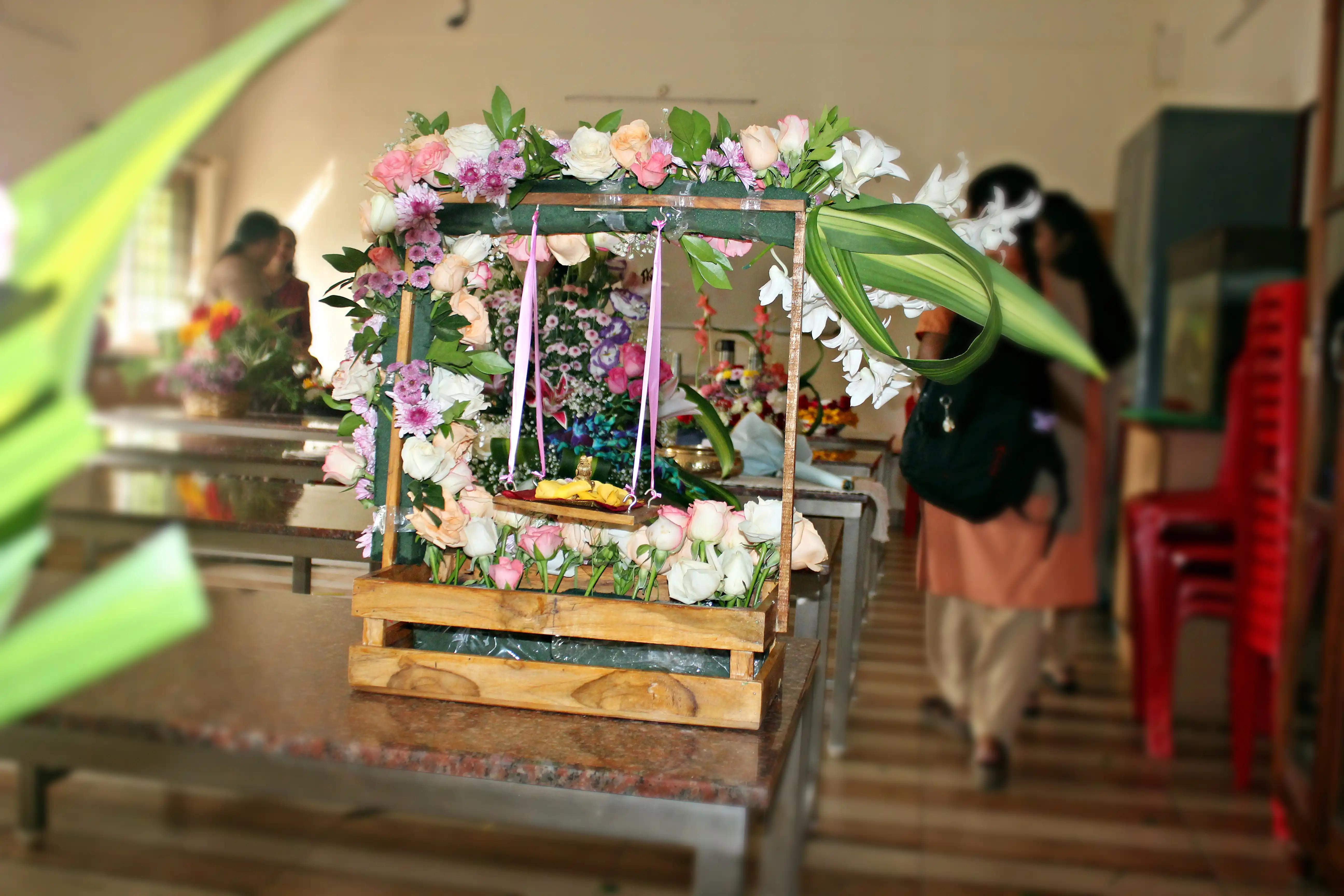 Colourful flowers arranged creatively by students