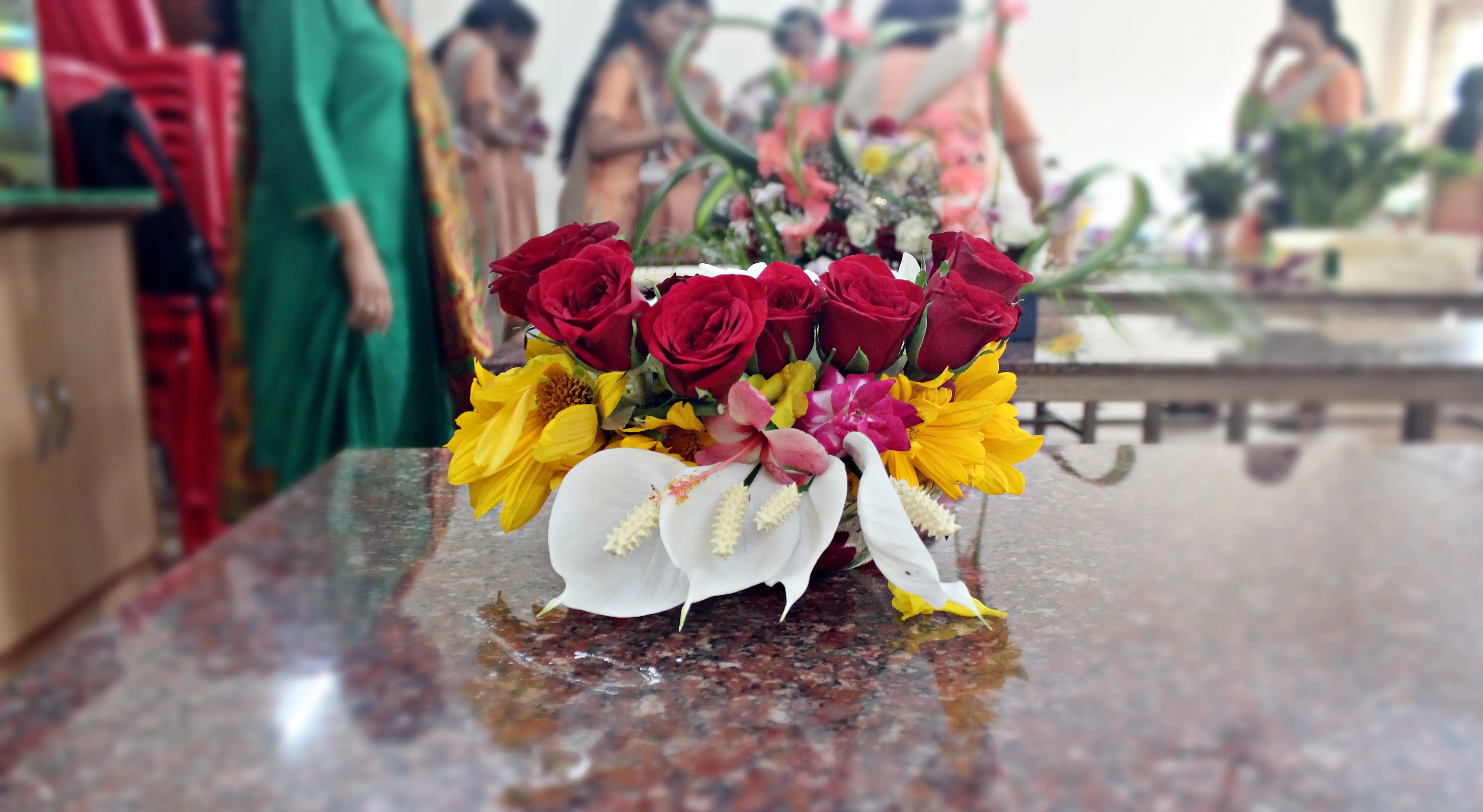 Colourful flowers arranged creatively by students