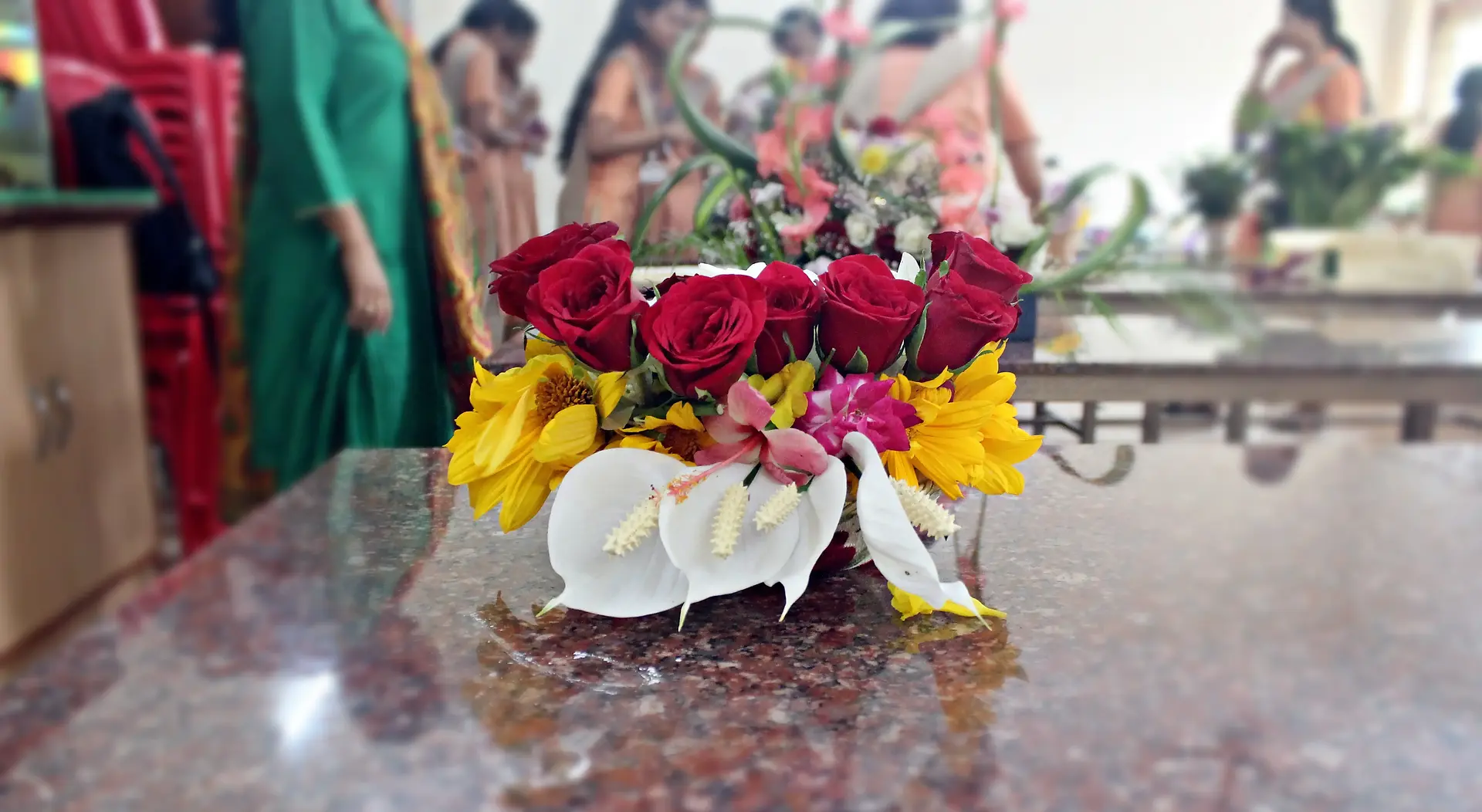 Colourful flowers arranged creatively by students