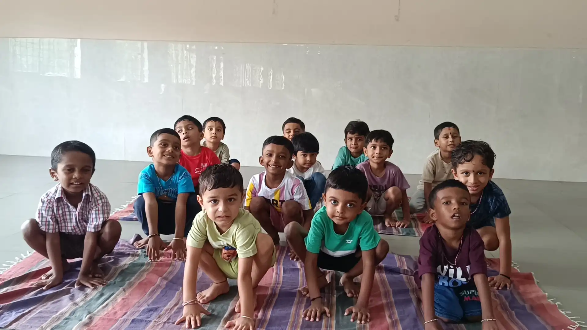 Children practicing yoga postures at Vidyodaya Public School