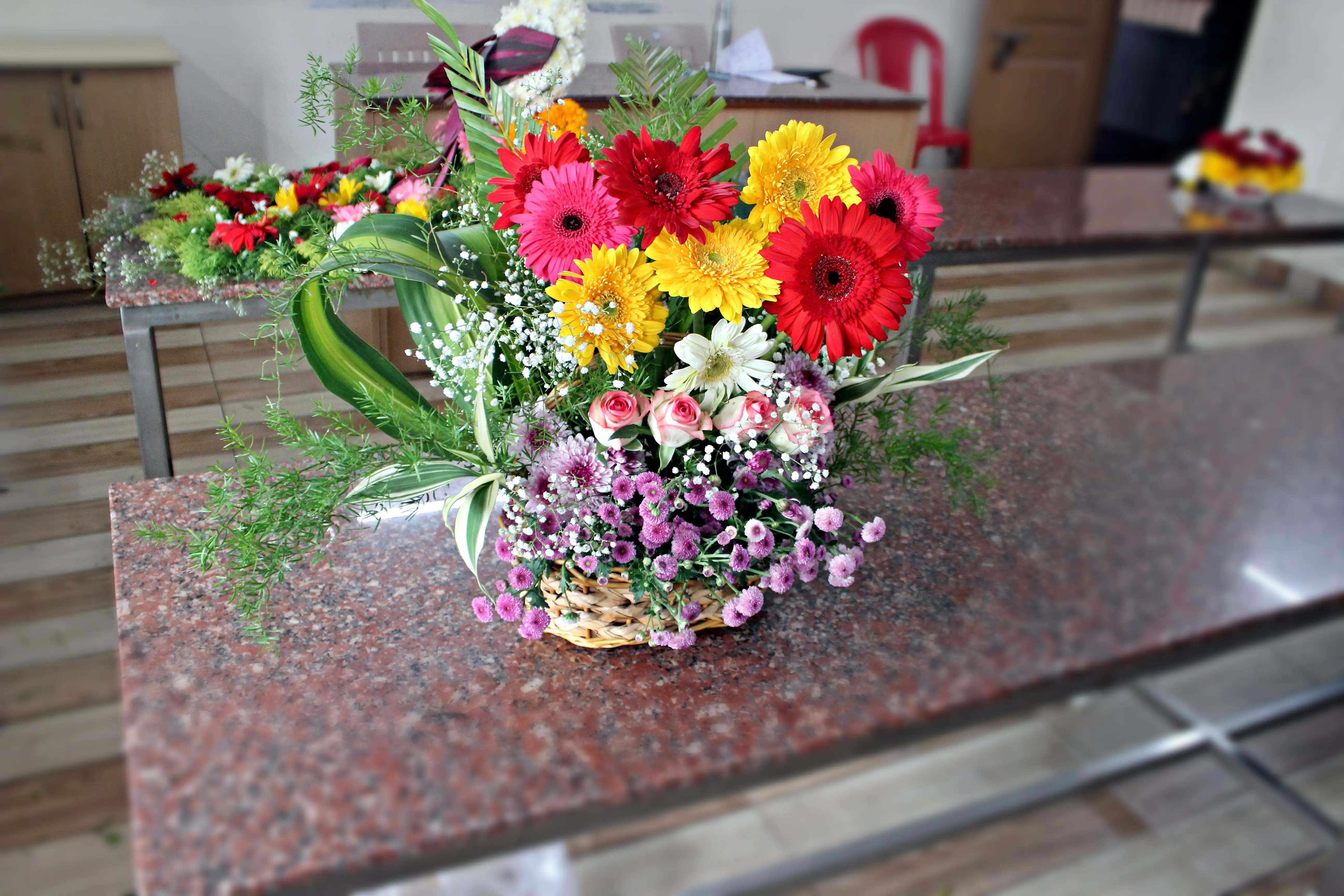 Colourful flowers arranged creatively by students