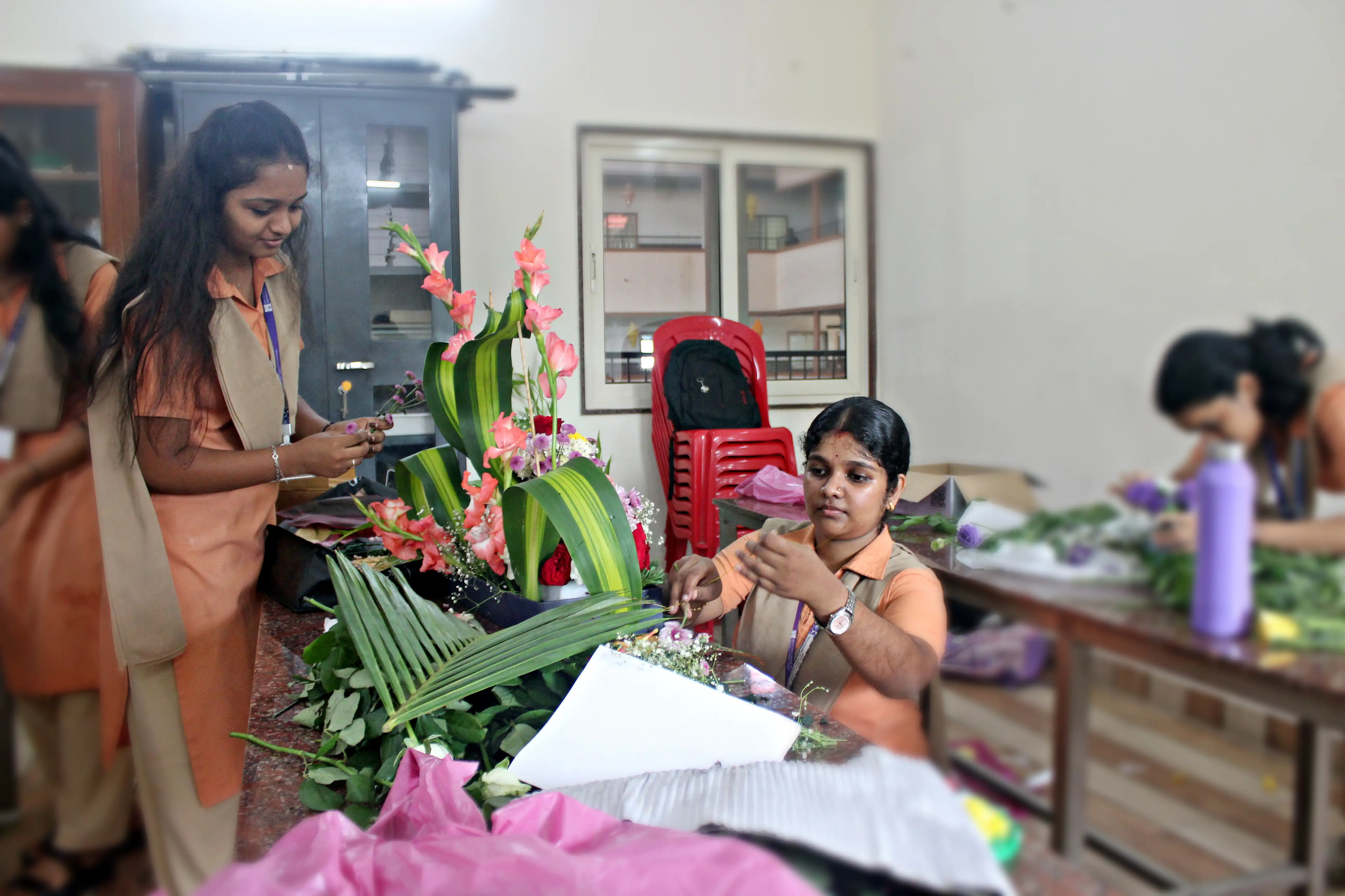 Students arranging flowers during the Flower Arrangement Competition