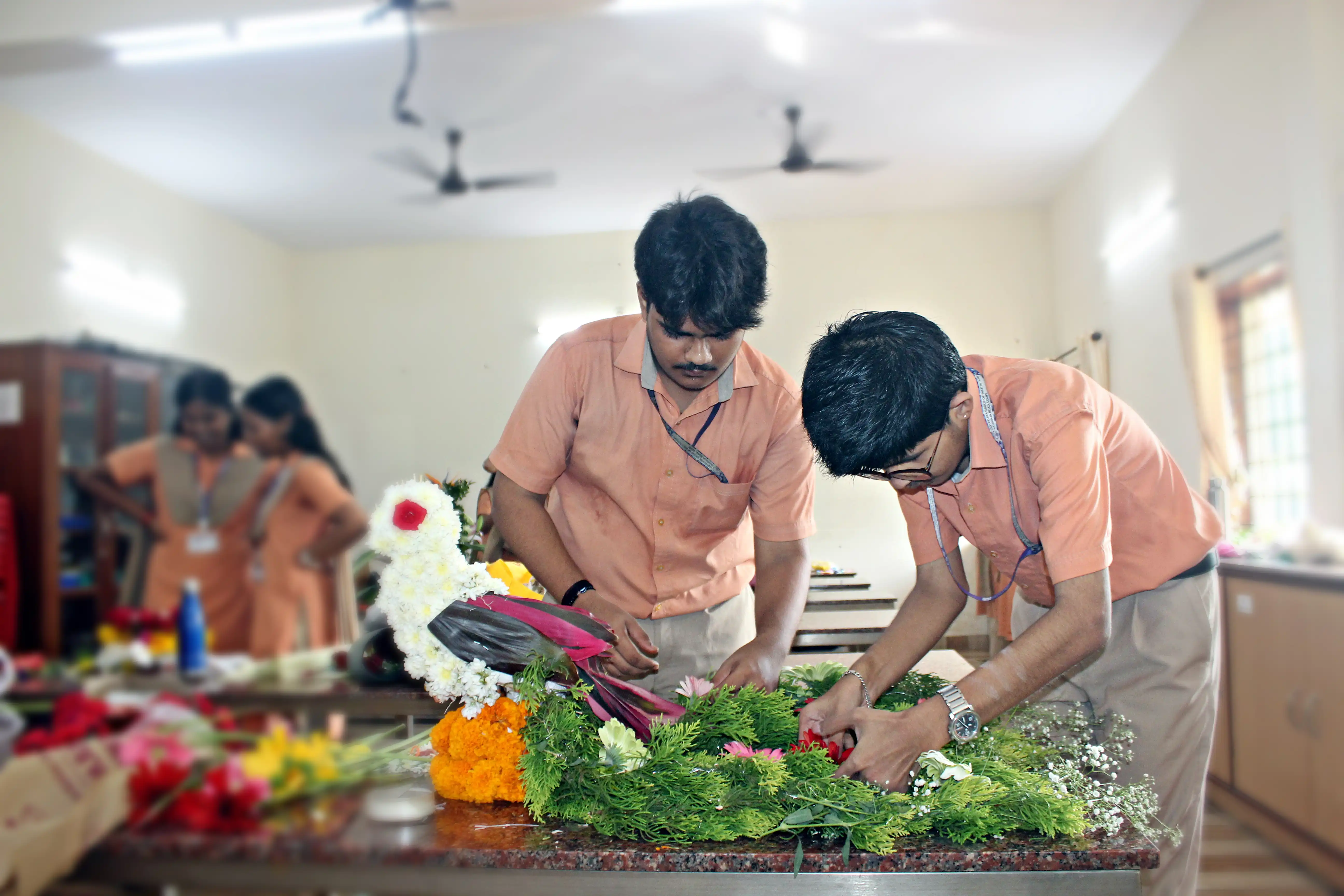 Students arranging flowers during the Flower Arrangement Competition