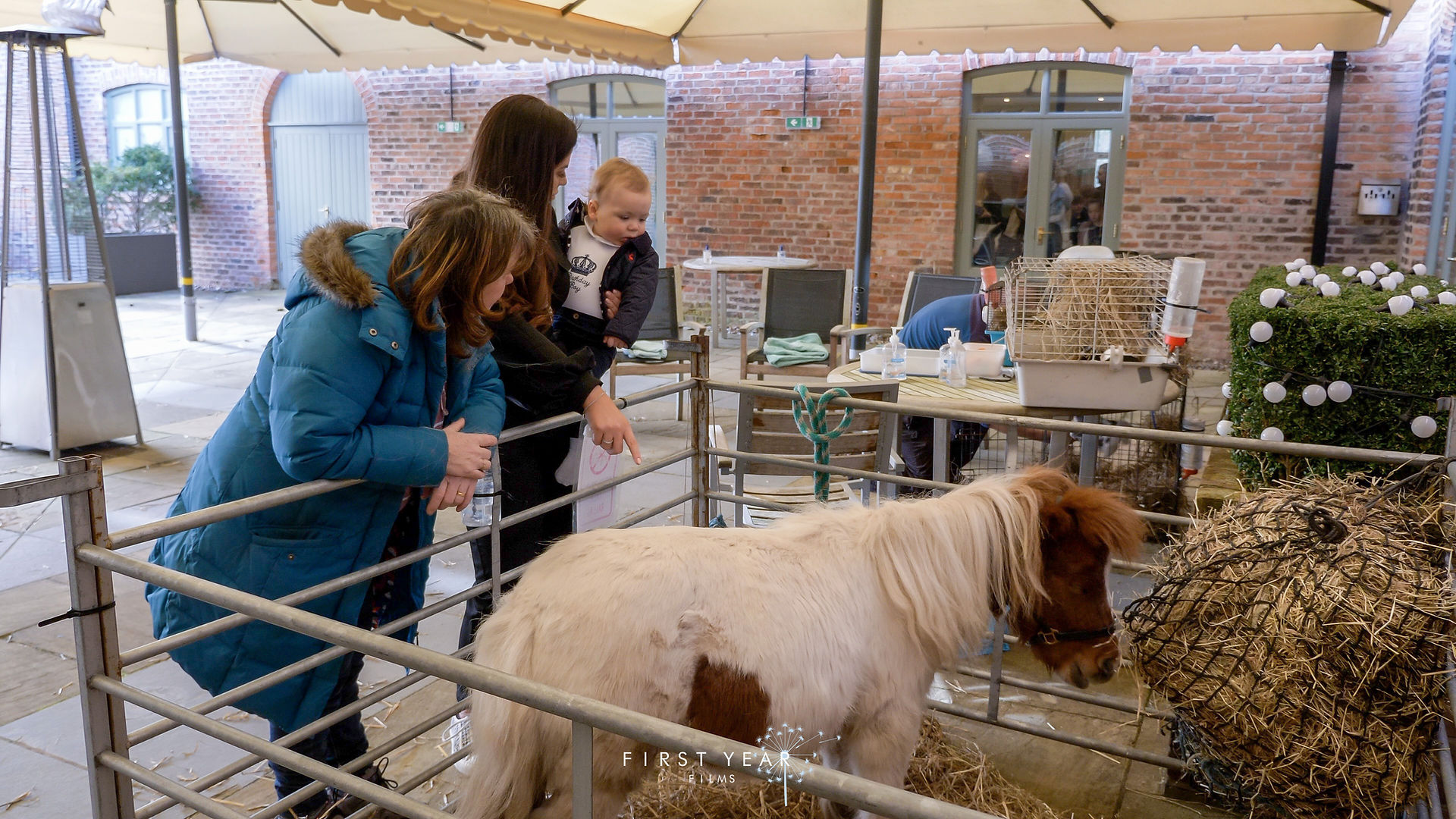 FIRST YEAR FILMS: Baby Henri Chester and mummy Rea Chester look at pony at Henri's birthday party