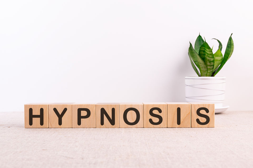 HYPNOSIS word made with building blocks on a light background.jpg