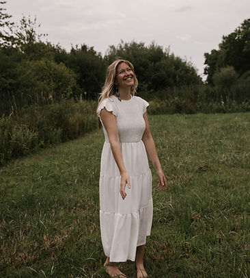 women standing in nature with white dress