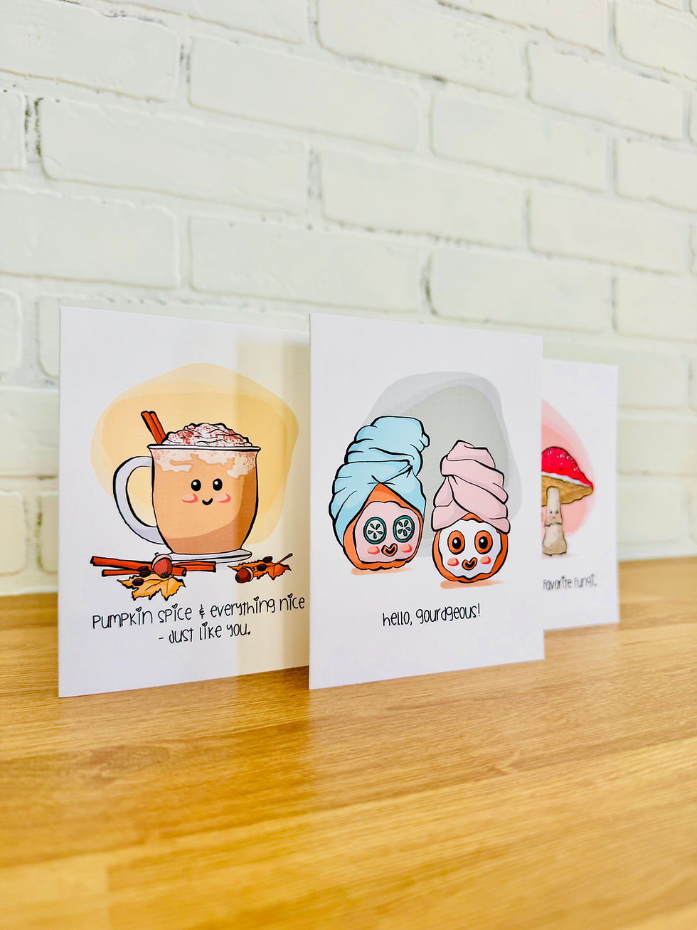 Thumbnail: Funny pumpkin greeting card with spa-day pumpkins wearing face masks, cucumber eyes, and towels, text “Hello Gourdgeous.”