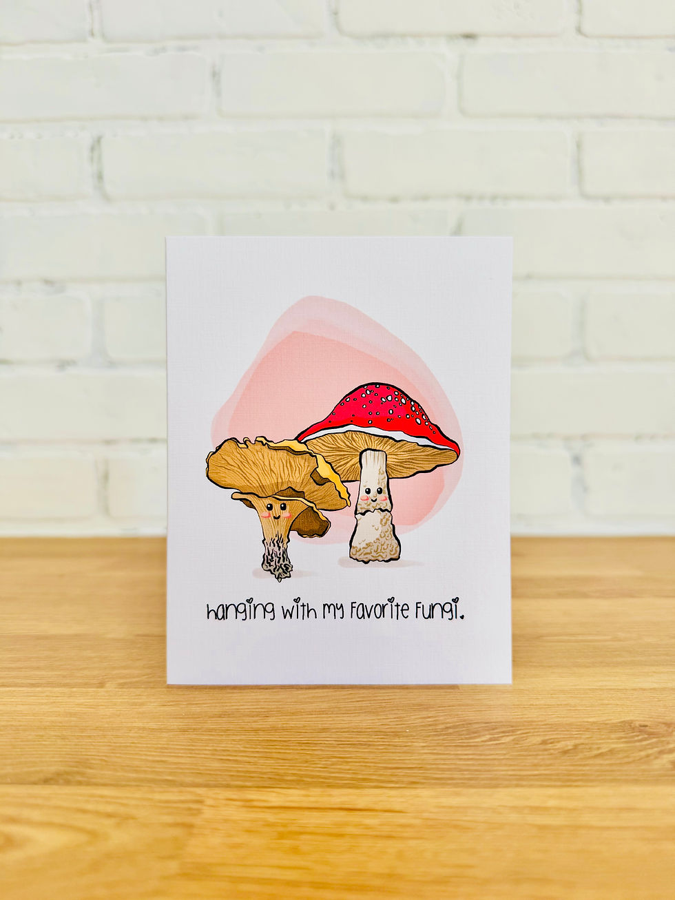 Cute mushroom greeting card with pun “Hanging with My Favorite Fungi,” whimsical red and white mushrooms.