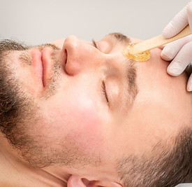 man having eye brow wax.jpg