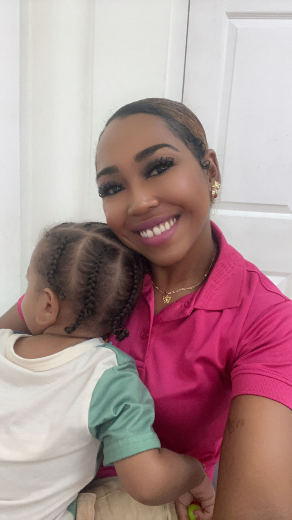 Aunty Shantal takes a picture with Ki on the first day at iLearn Academy for 2025