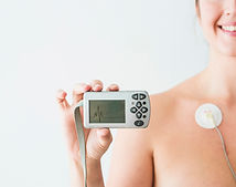 woman-with-electrodes-holding-monitor-with-cardiogram.jpg