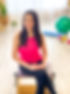 Female Pilates Instructor sitting on Wunda Chair.jpg