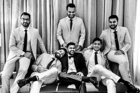 Groom and his groomsmen in a funny group pose