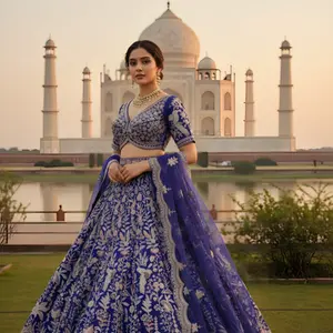 Royal blue lehenga, gold embroidery, Taj Mahal photoshoot, iconic bridal wear, luxury destination.