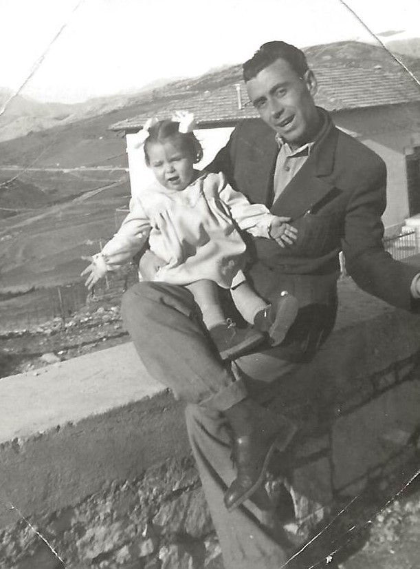 Dad holding me so I can do "jazz hands". Could those bows BE any bigger?
