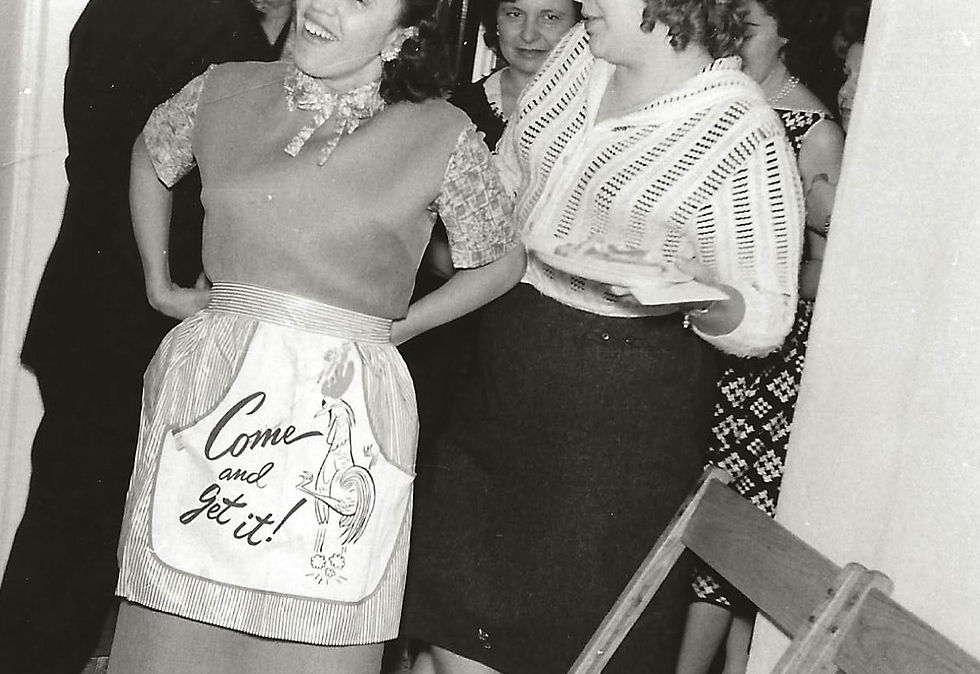 I can't tell you how many photos I have of family members whose heads were decapitated by a well-intentioned, but skill-deprived photographer, but here we are. I can tell you that the woman with the apron is my Comare Carmela. She recently passed away at the age of 97. She was a great cook, exceptional hostess, and one of my favorite people in the entire world. I can only guess who the others might be at this family gathering, although I think the woman in the background might be my brother's godmother.