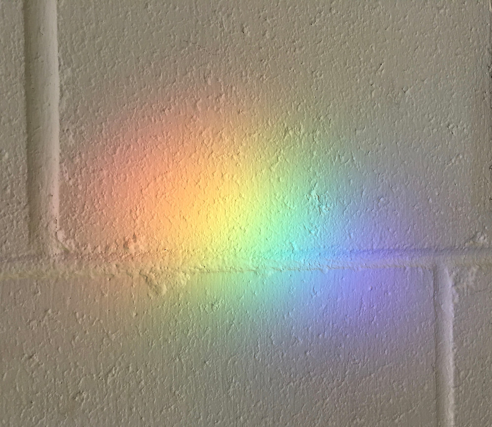 rainbow on a wall at a parking garage
