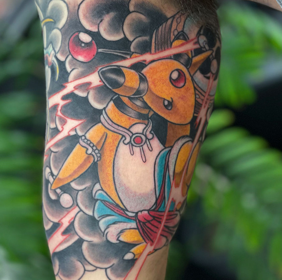 pokemon tattoo on the inner bicep of ampharos as raijin the god of thunder in colour 
