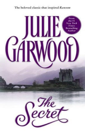 Book cover for Julie Garwood’s The Secret, with purple title text, a castle by water, and a misty bridge landscape.