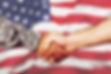 American soldier in uniform and civil man handshake