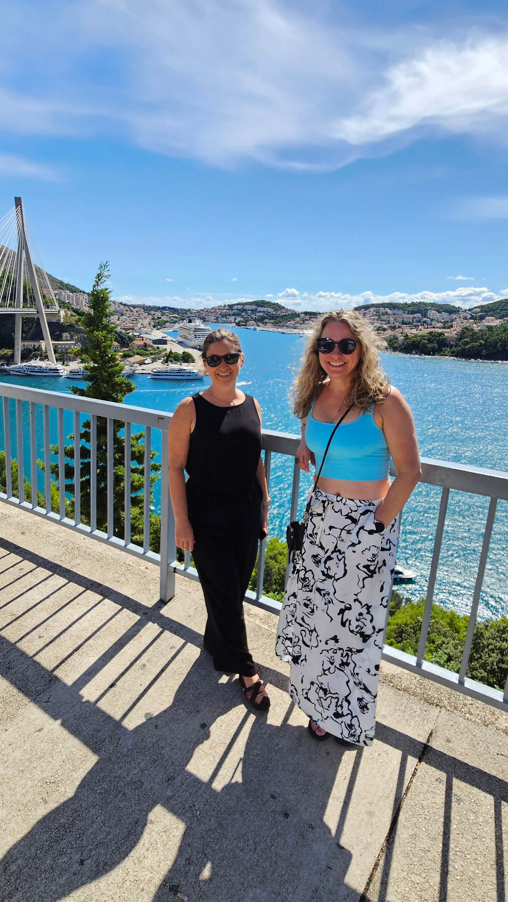Two women standing on a bridge overlooking Dubrovnik Croatia
