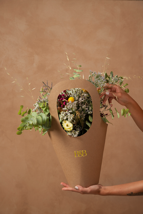side-view-hands-holding-basket-with-flowers