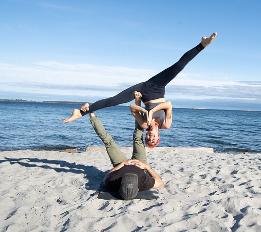 An acroyoga pose showing the acro workshops we offer in Victoria bc