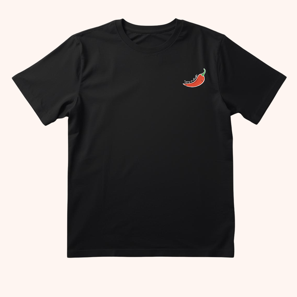 Black T-shirt featuring a red chilli pepper pocket design and the words “Spicy as fuck!” in white handwritten lettering.