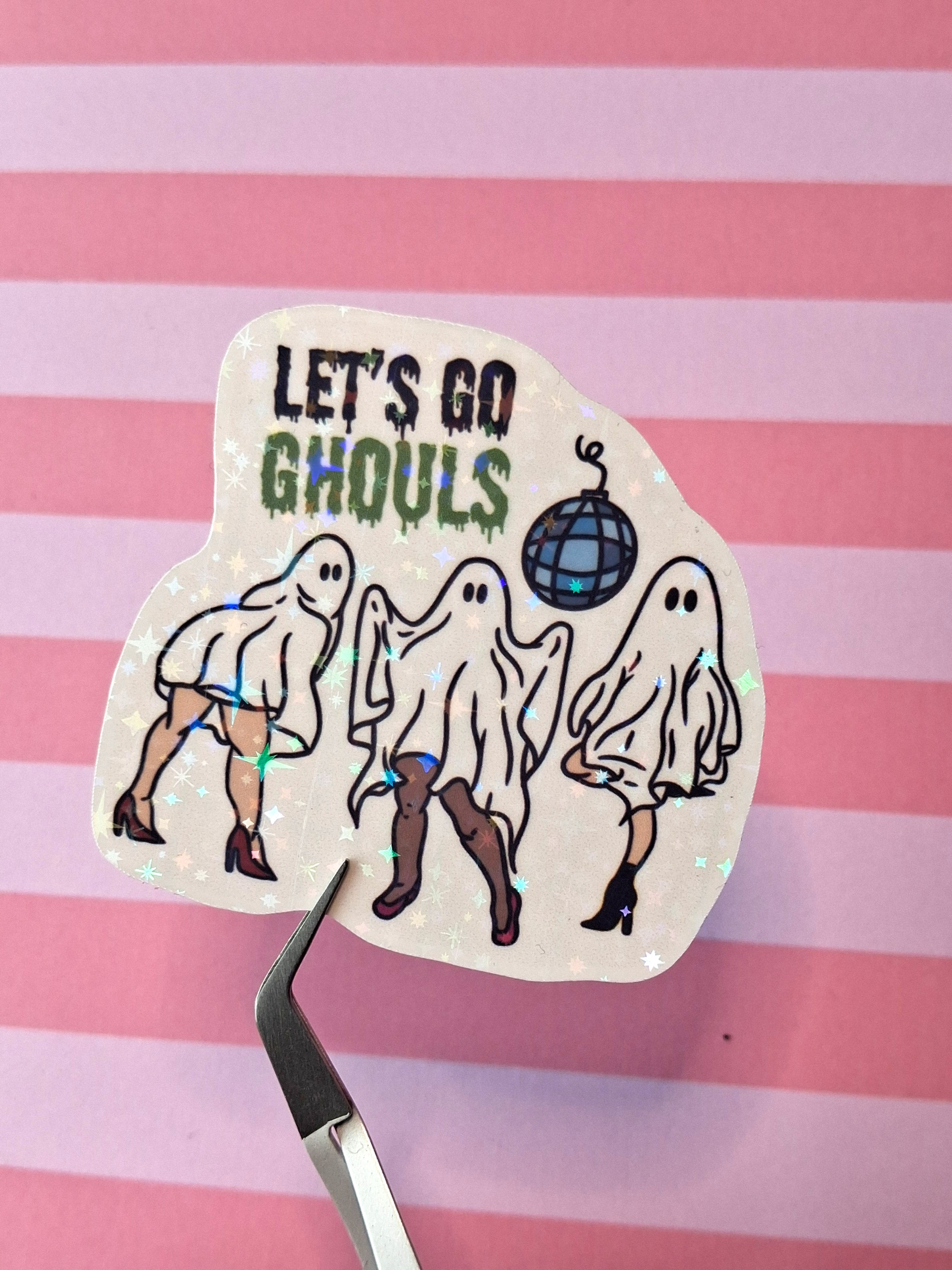 Holographic Let's Go Ghouls sticker featuring three dancing ghosts in boots with a disco ball