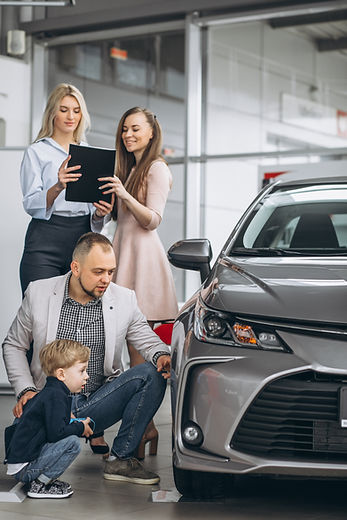 family-with-son-choosing-car-car-showroom.jpg