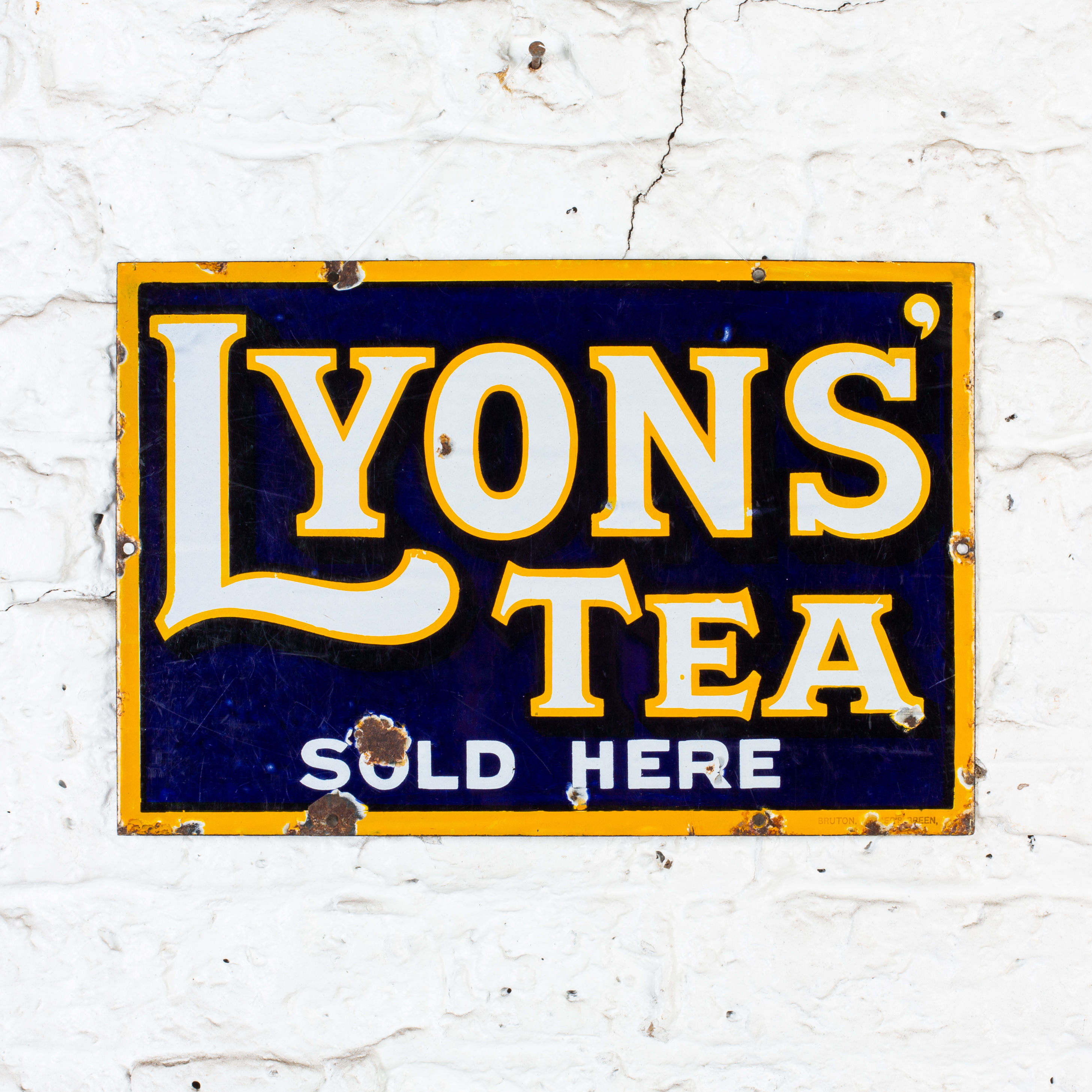 A SMALL, VIBRANT LYONS' TEA ENAMEL SIGN
