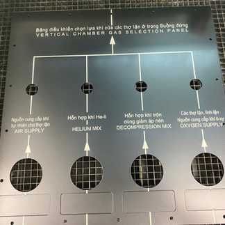 Industrial panel with laser engraved text before paint filling