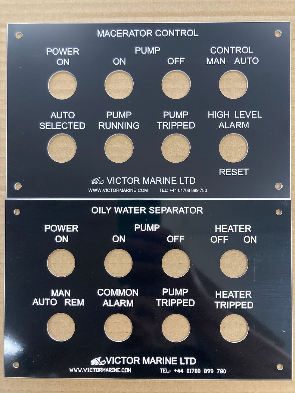 Figure 1 – Comparison of a modern laser engraved laminate control panel (top) and a traditional mechanically engraved Traffolyte panel (bottom). The laser engraved laminate reproduces fine text and logos with greater precision, while Traffolyte retains its characteristic appearance and remains a popular choice for many legacy and specification-driven applications.