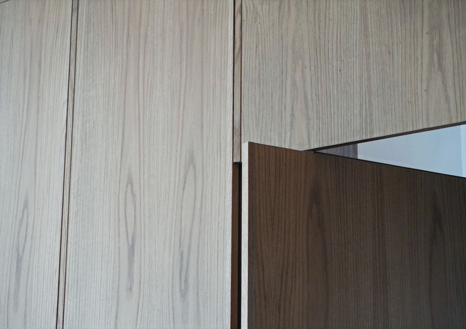 Close-up of contrasting light and dark timber panels and their joinery at Villa Gaia.