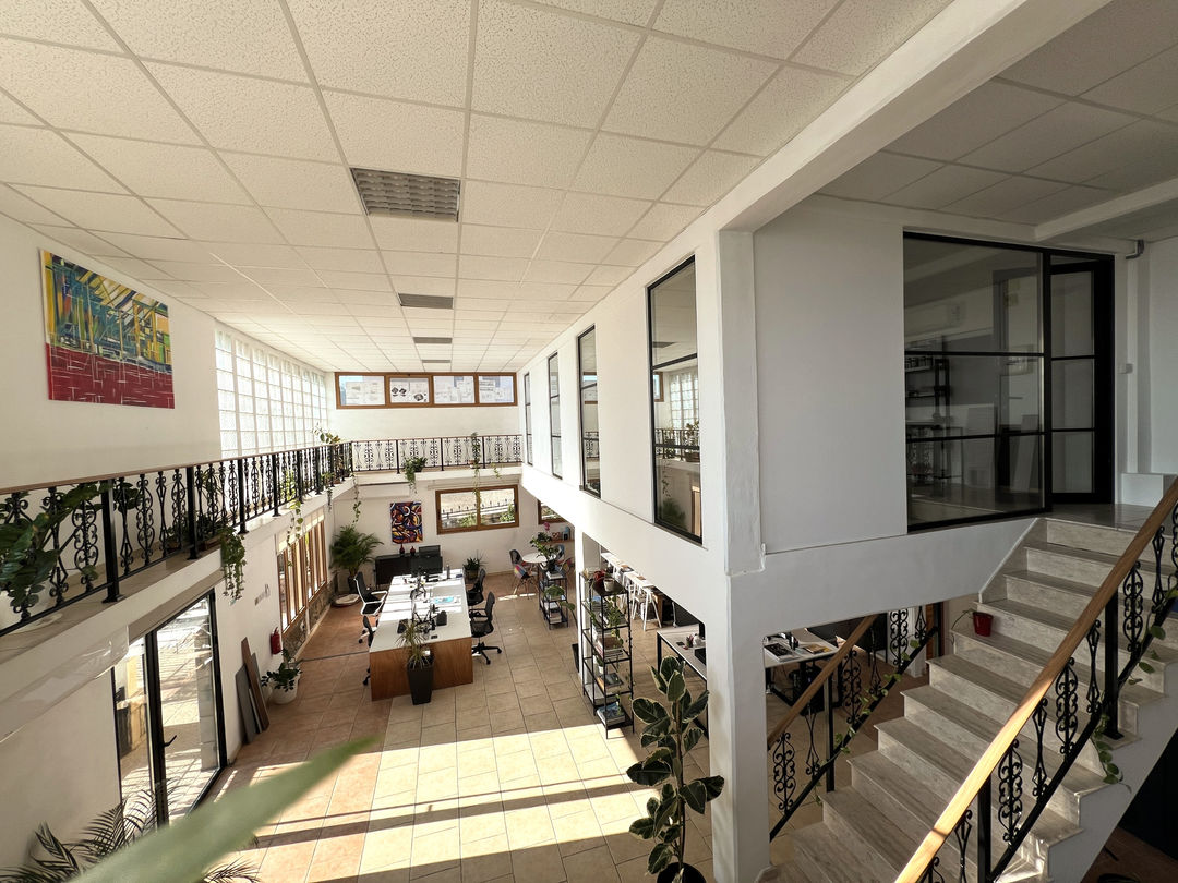 View from mezzanine, looking down into the main office space, bespoke furniture and materials library.